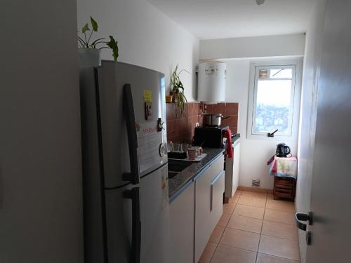 Kuchyň nebo kuchyňský kout v ubytování Comodo y luminoso