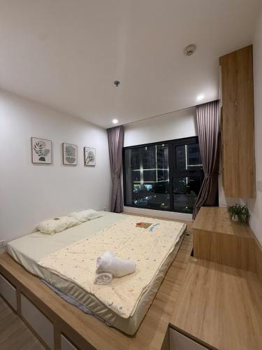 a bedroom with a large bed in a room at Moon Homestay 0308 in Gia Lâm Pho