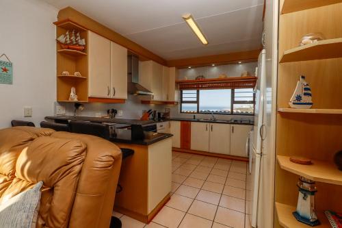a kitchen with a sink and a refrigerator at Ramsgate Mews 2 in Ramsgate