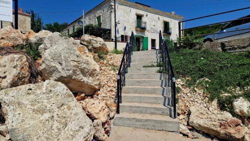 a set of stairs leading up to a stone building at Villa Bellavista in Kavarna