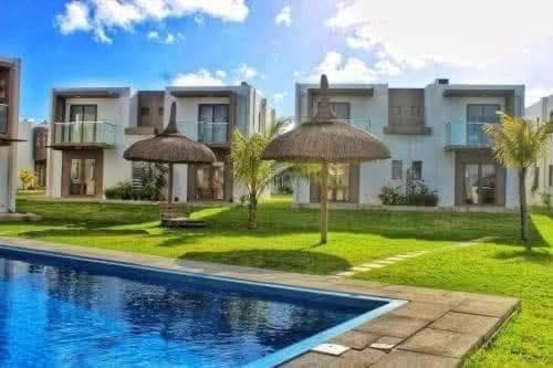 an image of a house with a swimming pool at Villa la Joie 2 bedrooms Apartment in Goodlands