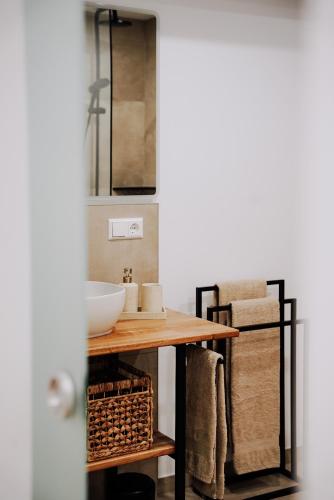 a bathroom with a sink and a mirror at Ferienwohnung Goldtann in Elzach