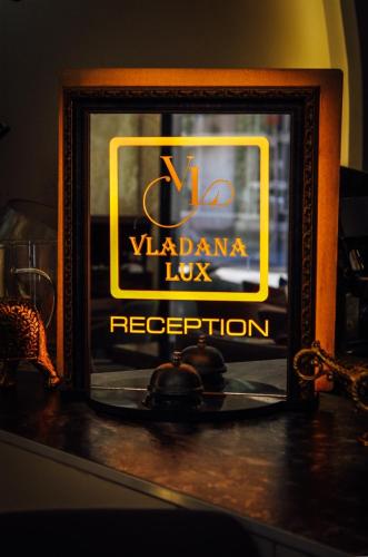 a sign for a vadana los reception at Vladana DELUXE App 2 in Kruševac