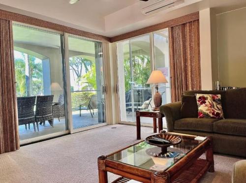 a living room with a couch and a table at The Palms Unit 501, condo in Wailea
