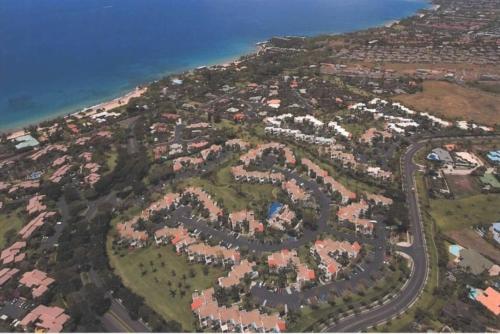 an aerial view of a city with houses and roads at The Palms Unit 501, condo in Wailea