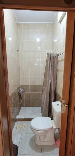 a small bathroom with a toilet and a shower at Idris home in Wadi Musa