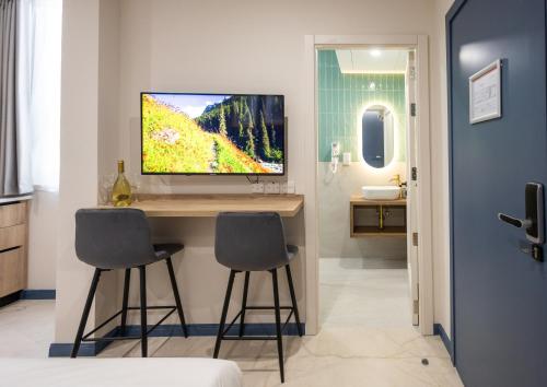TV a/nebo společenská místnost v ubytování Buena Vista Suites