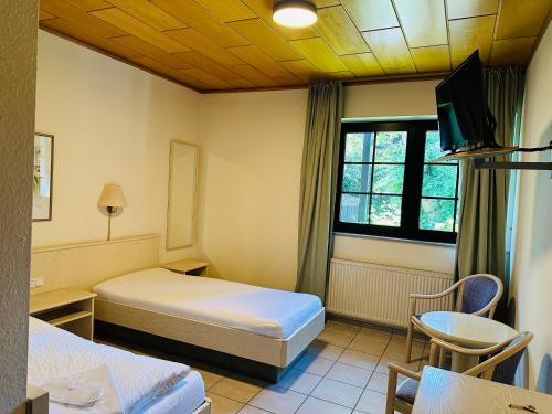 Ένα ή περισσότερα κρεβάτια σε δωμάτιο στο Gästehaus Tönisvorst