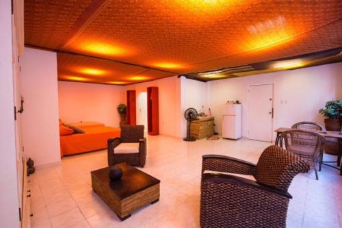 a living room with chairs and a couch and a table at Willemstad Punda in Willemstad