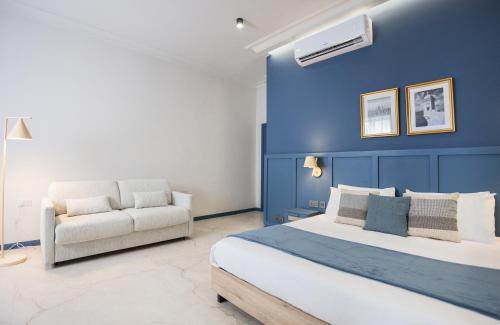 Postel nebo postele na pokoji v ubytování Buena Vista Suites