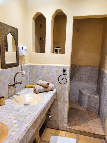 a bathroom with a sink and a shower at Riad Ain Khadra in Taroudant