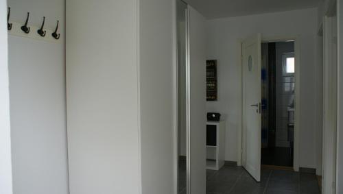 a hallway with a door leading to a room at Nordanå Gård in Strö
