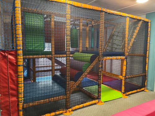 a play structure withadders in a play room at 23 Sea Valley, Quiet Chalet at Bideford Bay holiday park in Bideford