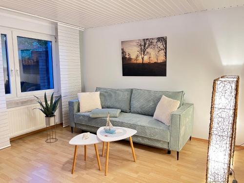 a living room with a couch and a table at Am Grünenplatz 63 in Wermelskirchen