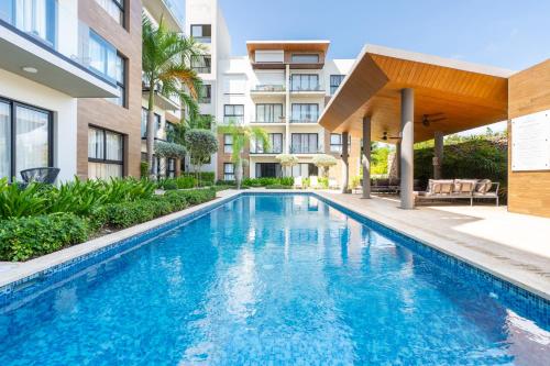 an image of a swimming pool in a building at Thematic beach apartment in CapCana area in Punta Cana