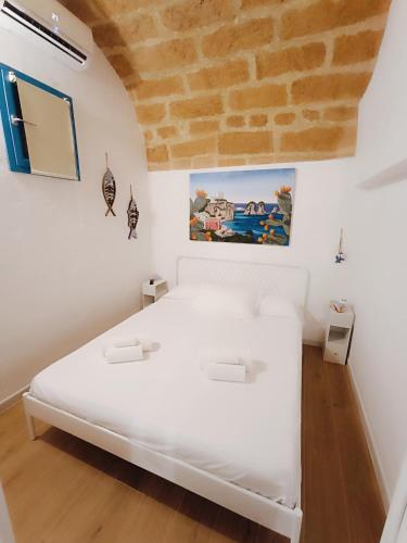 Postel nebo postele na pokoji v ubytování Casa Sciàpó