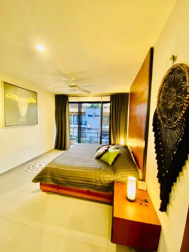 Ein Bett oder Betten in einem Zimmer der Unterkunft Lunada PH with Private Rooftop and Jacuzzi by Caribe Rentas