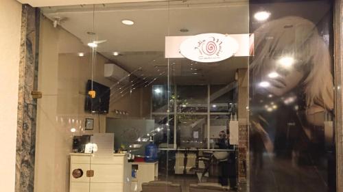a window of a store with a mannequin at GRU Airport Hotel - STAY HERE in Guarulhos