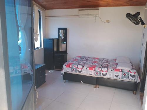 a bedroom with a bed in a room at Hotel Volga in Puerto López