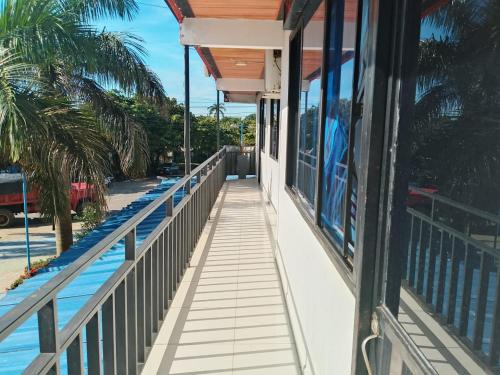 a balcony of a house with a view of the water at Hotel Volga in Puerto López