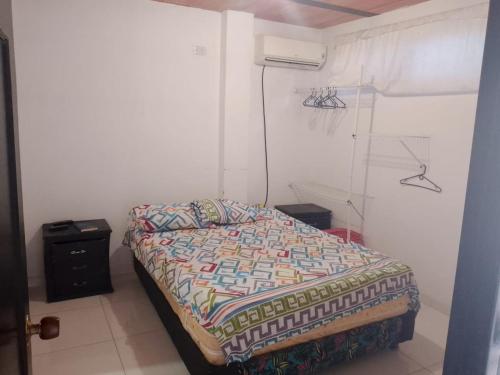 a bedroom with a bed in a room at Hotel Volga in Puerto López
