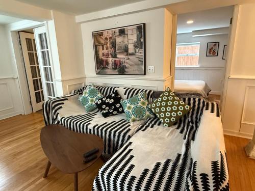 a living room with a couch with pillows on it at walk distance to kits beach 2bedrooms only for you in Vancouver
