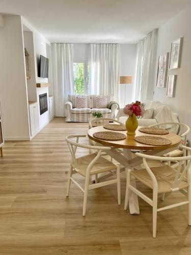 a living room with a table and chairs at Elena Playa Sol in Alcudia