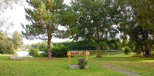 a sign that says sweet lake in a park at Castleton Static lodge on Wold View Fisheries Leisure Park in Usselby