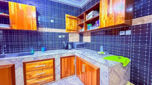 Kuchyň nebo kuchyňský kout v ubytování Ramana Suites