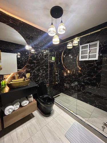 a bathroom with a shower and a sink at GP-ModernOasis 