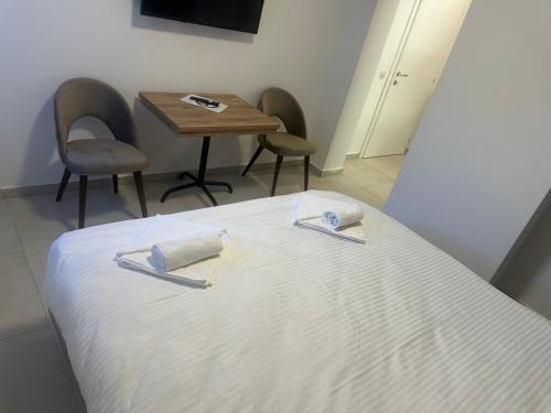 Ένα ή περισσότερα κρεβάτια σε δωμάτιο στο Hotel Belica