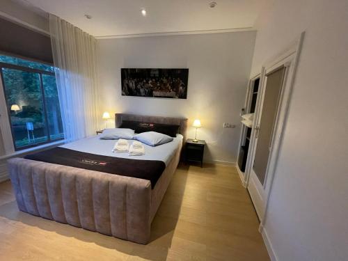 a bedroom with a large bed in a room at Weezen by Gracht in Zwolle