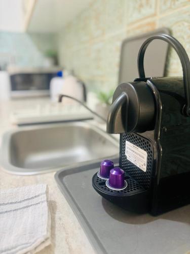 a coffee maker sitting on top of a kitchen counter at Beachfront Studio, fully equipped in Netanya