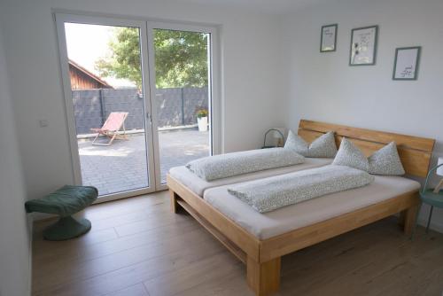 Postel nebo postele na pokoji v ubytování Ferienwohnung Im Wiesengrund