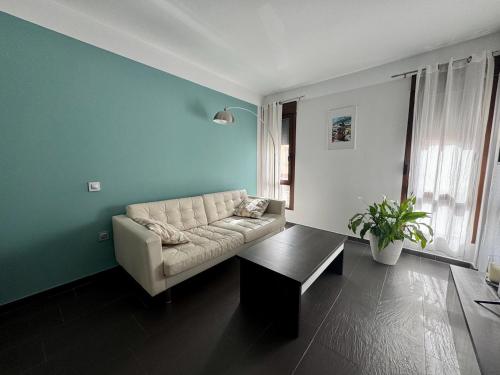 a living room with a couch and a table at Apartamento rural Castillo de Yeste 2 pax in Yeste