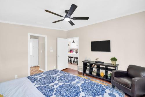 a bedroom with a bed and a ceiling fan at Walk to Blue Jays, Breweries, Marina & Beaches in Dunedin