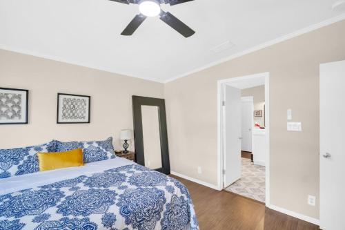 a bedroom with a bed and a ceiling fan at Walk to Blue Jays, Breweries, Marina & Beaches in Dunedin