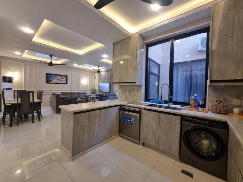 a kitchen with a washing machine in the middle at Fantastic Spanish Villas In Heart Of Mirpur Azad Kashmir Pakistan in Rachiāl
