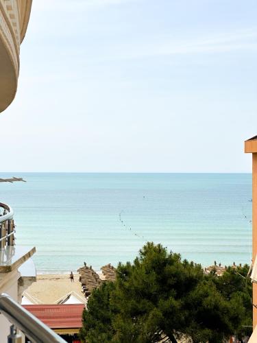 a view of the beach from a building at Blumoon Holiday in Golem