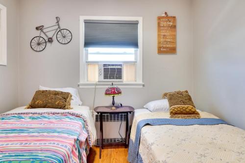 a bedroom with two beds and a bike on the wall at The Vault Your Fun Secured in Hillside