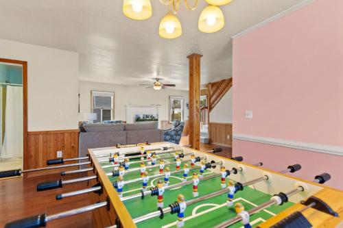a living room with a table with dolls on it at 7074 - Seashells and Sunsets in Nags Head