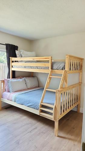two wooden bunk beds in a room with at Sandy Pacific Hideaway 1 in Florence