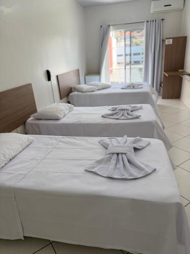 Ένα ή περισσότερα κρεβάτια σε δωμάτιο στο Hotel Ideal Beltrão