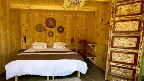 Postel nebo postele na pokoji v ubytování Cabin Arroyo el Bosque, Villa Cerro Castillo, Aysen