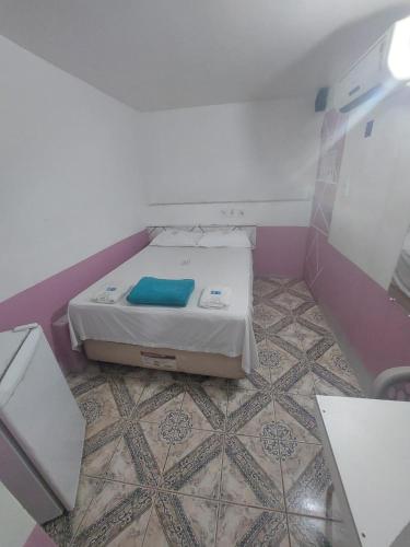 a small room with a bed in the corner at Pousada Casa Sonhos in São Luís