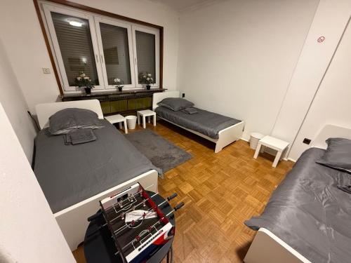 a dorm room with two beds and a window at Sleep Point Bremermann in Bremen
