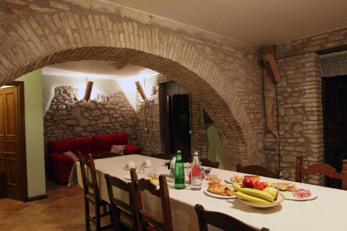 a table with plates of food on top of it at Il Casale della Quercia in Assisi