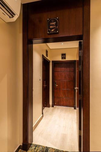 an entrance to a building with a wooden door at فندق فيو الشاطي - Beach View Hotel in Dammam