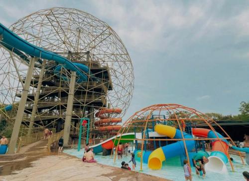 a water park with two slides and a roller coaster at Alojamiento Sol Naciente in Puerto Triunfo