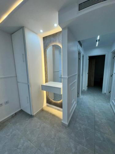 a bathroom with a sink and a mirror on the wall at Yasmina apart in Bejaïa
